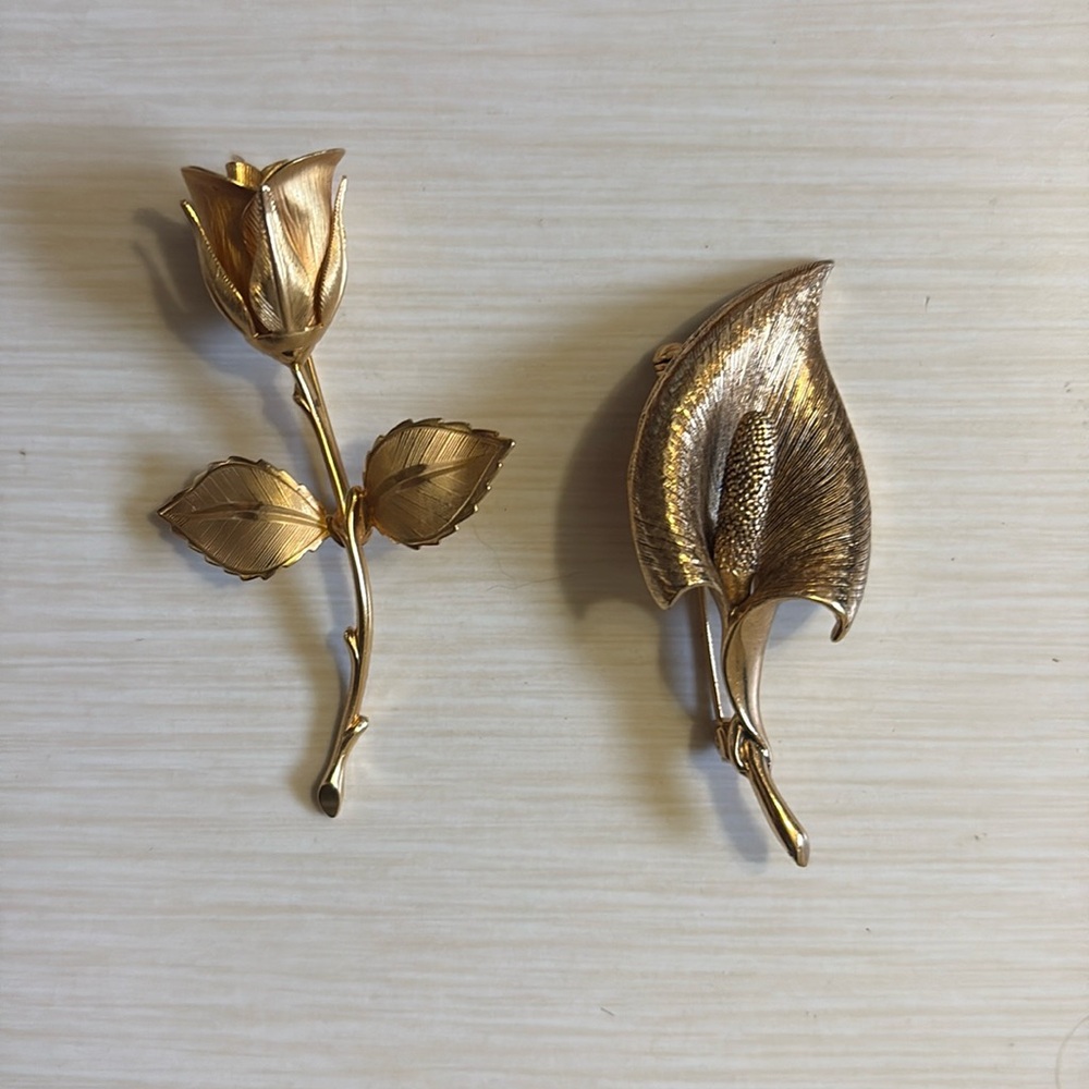 Gold tone brooches